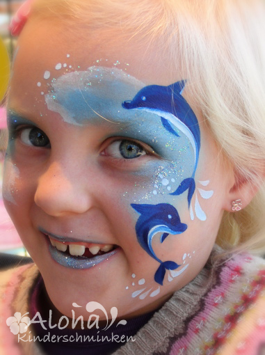 Dolphin face painting design in blue tones