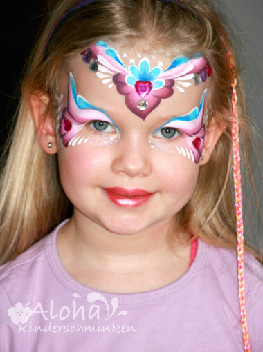 Fairy face painting with soft colours and glitter accents