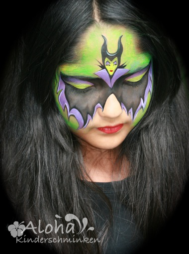 Witch face makeup with dark accents for Halloween