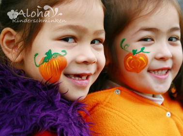 Pumpkin face paint design for Halloween with bright colors