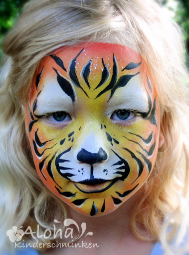 Tiger face painting with detailed lines and expressive look